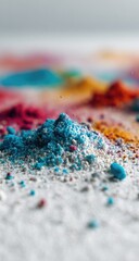 Obraz premium Close-up of colorful powder mounds on a white surface