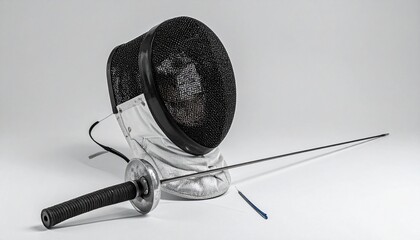 Fencing equipment laid out on a white surface, including a black mesh and white padded mask, white gloves with colored detailing, and two metallic fencing swords with protective guards, showcasing the