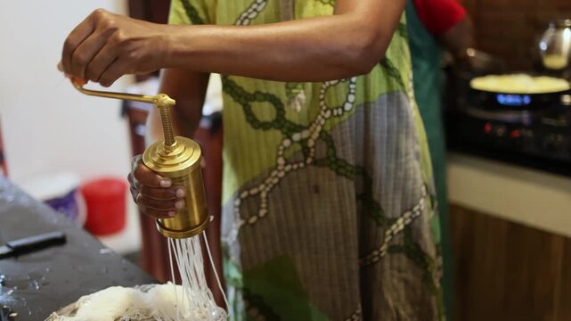 Cooking process of traditional South Indian Idiyappam string hoppers rice noodles