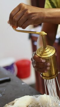 Cooking process of traditional South Indian Idiyappam string hoppers rice noodles