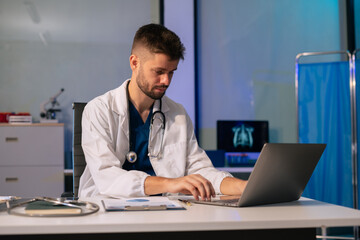 Doctor physician with stethoscope calculate medical fee costs & revenue. practitioner use calculator