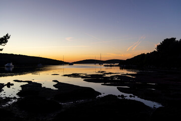 Silhouette of sailboat in spectacular sunset on the island of Pasman in Croatia