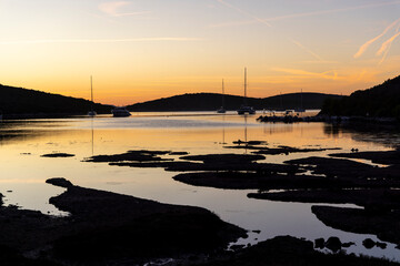 Silhouette of sailboat in spectacular sunset on the island of Pasman in Croatia