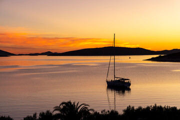 Silhouette of sailboat in spectacular sunset on the island of Pasman in Croatia
