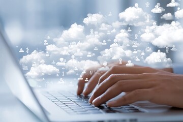 Hands typing on a laptop, cloud icons disperse
