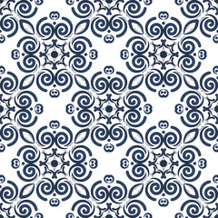 Fototapeta premium Elegant seamless floral tile pattern with blue tone.