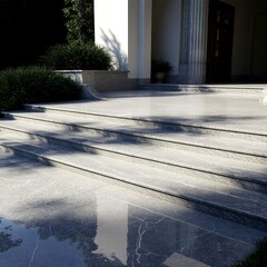Outdoor villa entrance flooring designed with grey marble tiles wide steps greenery and soft lighting creating majestic elegant luxury ambiance