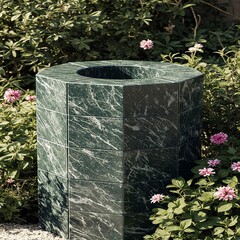 Outdoor garden fountain base designed with green marble tiles surrounded by flowers and lighting creating harmonious natural elegant environment