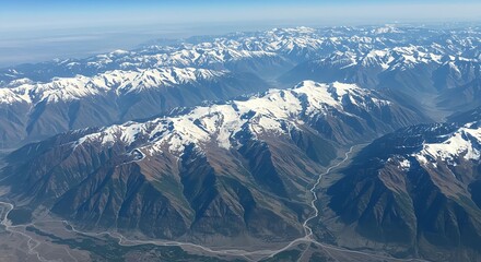 Aerial View of Snow-capped Mountain Range with Green Valleys and River in Natural Lighting