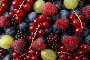 Different ripe juicy berries as background, closeup