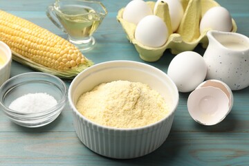 Making cornbread. Different ingredients on light blue wooden table, closeup