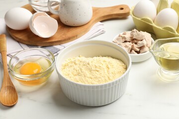 Making cornbread. Different ingredients on white marble table, closeup