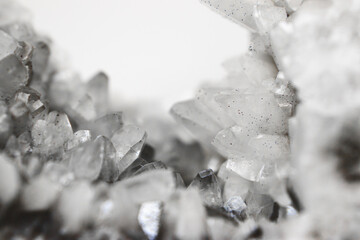 Macro of black and white quartz mineral with layered stone texture and translucent crystal formations in the center. Perfect for geology, mineralogy, natural backgrounds and jewelry design.