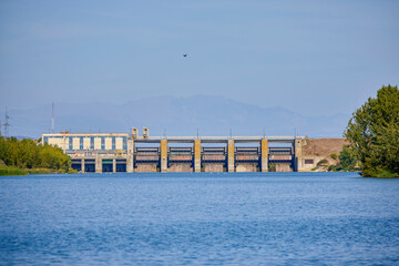 a dam on a river seen from the open water