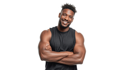 Smiling young man with muscular arms, wearing a sleeveless shirt, standing confidently with crossed arms.