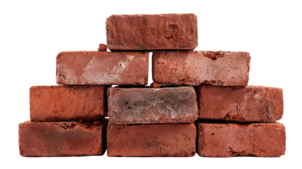 Stack of weathered red bricks on a white isolated background.