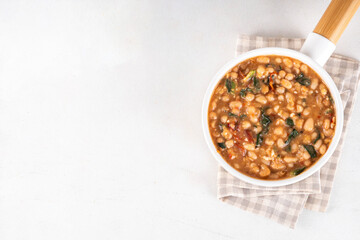 One pot Marry Me Butter Beans with white beans, Sun-Dried Tomatoes, spinach, garlic, hard cream and seasonings, fall season american comfort food, vegan healthy dinner rich in plant-based protein