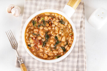One pot Marry Me Butter Beans with white beans, Sun-Dried Tomatoes, spinach, garlic, hard cream and seasonings, fall season american comfort food, vegan healthy dinner rich in plant-based protein