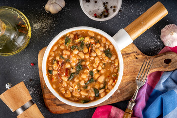 One pot Marry Me Butter Beans with white beans, Sun-Dried Tomatoes, spinach, garlic, hard cream and seasonings, fall season american comfort food, vegan healthy dinner rich in plant-based protein