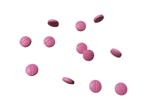 Pink Medicine Tablets or Supplement Pills Flying in the Air on a Transparent Background