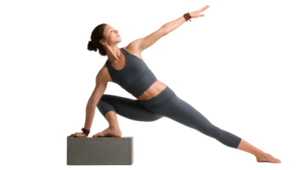 Woman practicing yoga pose with block, white isolated background