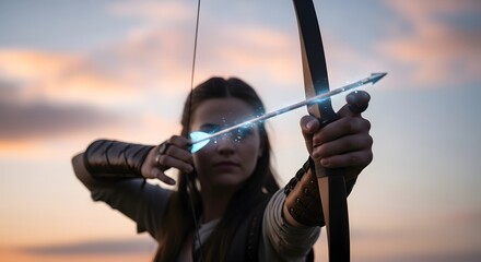 Obraz premium Archer aiming a glowing arrow at sunset, showcasing determination in a fantasy setting