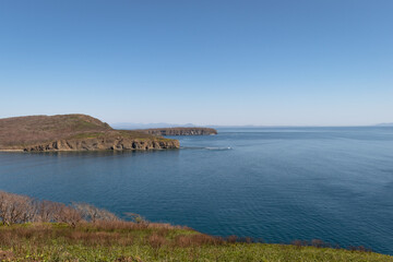 Dramatic Sea Cliffs and Clear Blue Ocean at Russky Island, Vladivostok, Russia