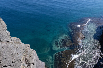 Dramatic Sea Cliffs and Clear Blue Ocean at Russky Island, Vladivostok, Russia