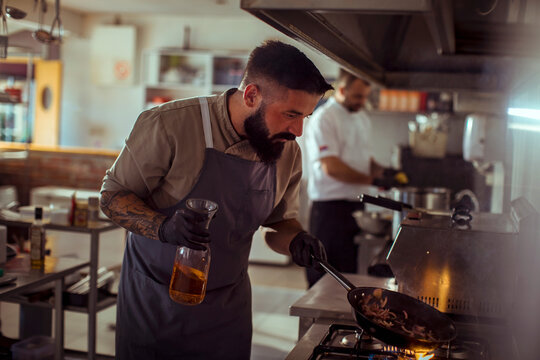 Chef cooking in modern kitchen
