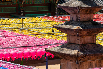 high angle view of the stone pagoda and colorful lotus lantern at the Buddhist temple
