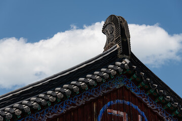 decoration on the tiled roof at the Buddhist temple