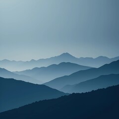 Fototapeta premium Soft, layered mountain silhouettes in gradient tones of deep blue fading into grey
