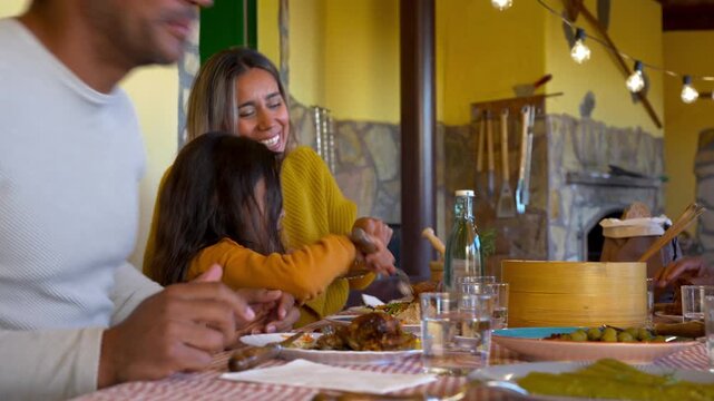 Happy latin family having fun eating lunch together at house terrace - Autumn season, multi generational people and lifestyle concept 