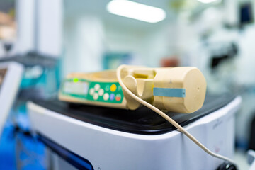 Medical device close-up in hospital. Close-up of a medical device used in hospital settings with blurred clinical background.