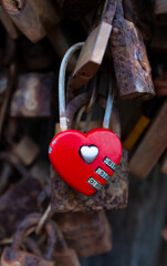 Romantic Red Heart Padlock with other rusty padlocks