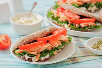 rye bread sandwiches with grilled salmon, veggies