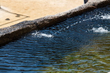 water stream from the fountain at the Buddhist temple