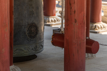 temple bell and wooden ram at the Buddhist temple