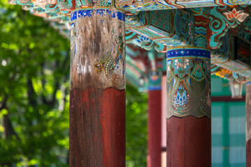 old wooden pillar at the Buddhist temple building