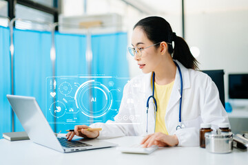 Asian female doctor using AI technology on laptop in hospital lab. Modern healthcare, digital innovation, medical data analysis, and smart diagnosis with real people concept.