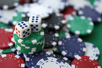 Dice game on the poker table in the casino. A successful combination of dice brought a lot of winning chips