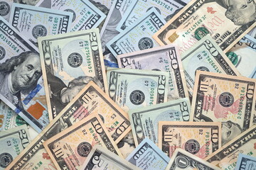 Big amount of different dollar bills close up. Hundred fifty twenty ten and five dollar banknotes