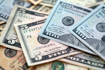 Big amount of different dollar bills close up. Hundred fifty twenty ten and five dollar banknotes