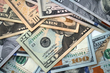 Big amount of different dollar bills close up. Hundred fifty twenty ten and five dollar banknotes