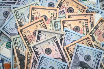 Big amount of different dollar bills close up. Hundred fifty twenty ten and five dollar banknotes