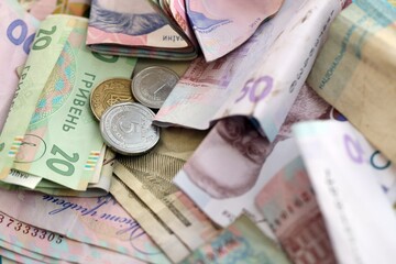 Big amount of different Ukrainian hryvnia money bills. Pile of crumpled ukrainian banknotes