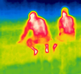 Sitting on the railing. Image from thermal imager device.