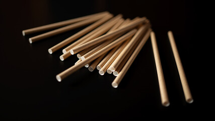Wooden chopsticks scattered on a dark surface ready for a meal or cooking