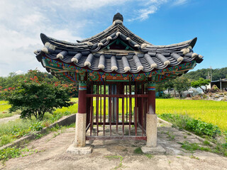 Obraz premium Traditional Korean stone monument pavilion protecting historic stele 