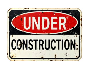 A weathered sign indicating construction work is in progress, featuring bold red and black lettering.